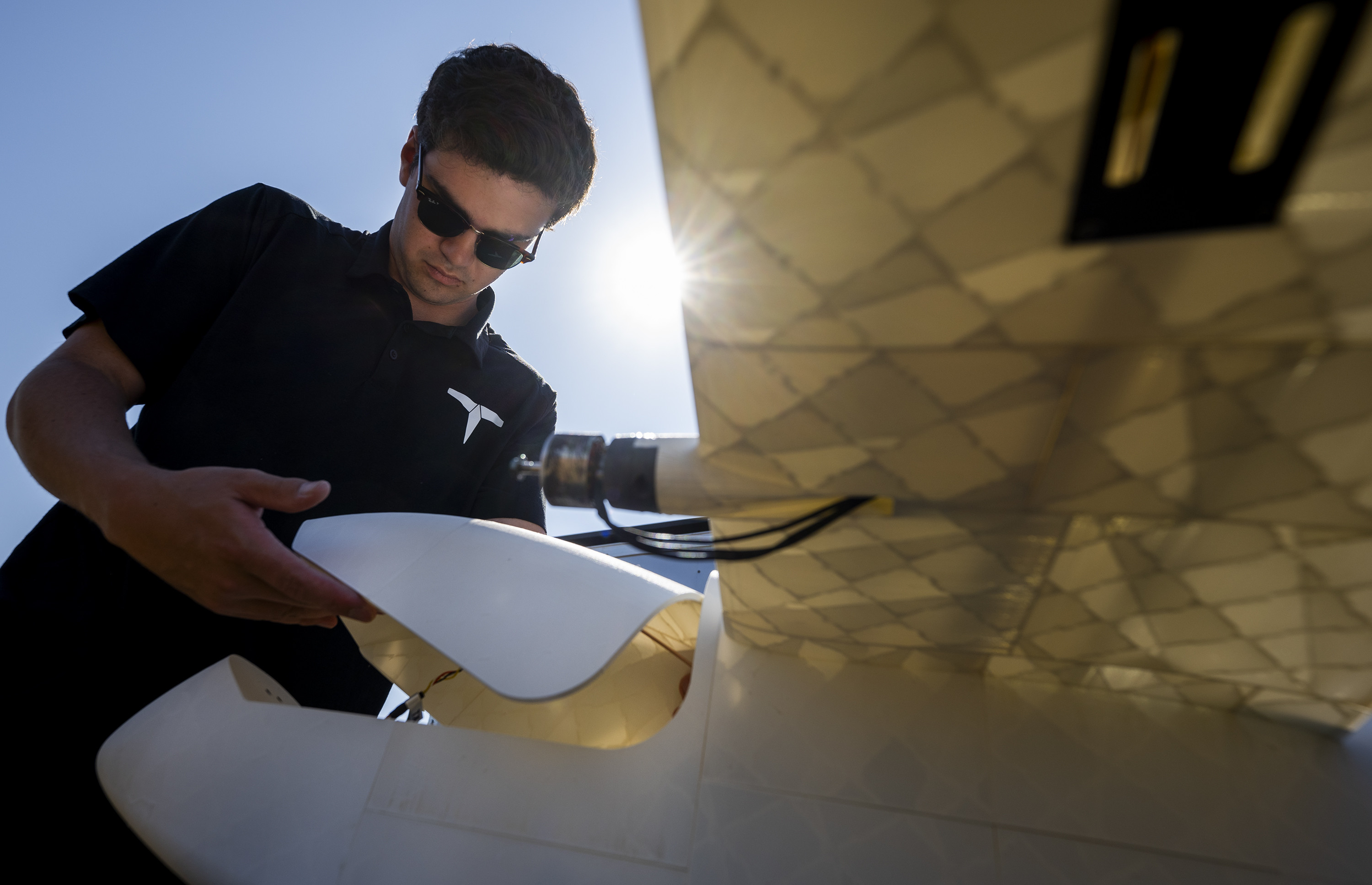 Noah Benton, Titan Dynamics chief technology officer, prepares 3D-printed unmanned aerial system for flight during demonstration, April 25, 2024, at Eglin Air Force Base, Florida (U.S. Air Force/Samuel King, Jr.)